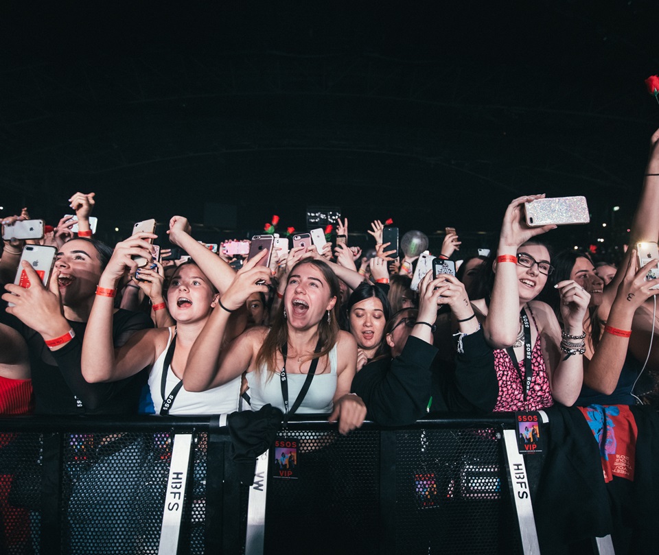 people at the front of a concert