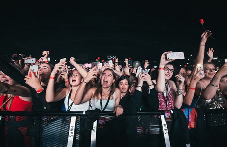 people at the front of a concert
