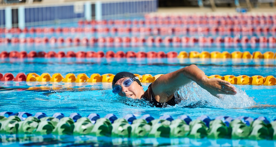 Adult swimming in lane pool