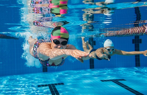 Two women swimming underwater